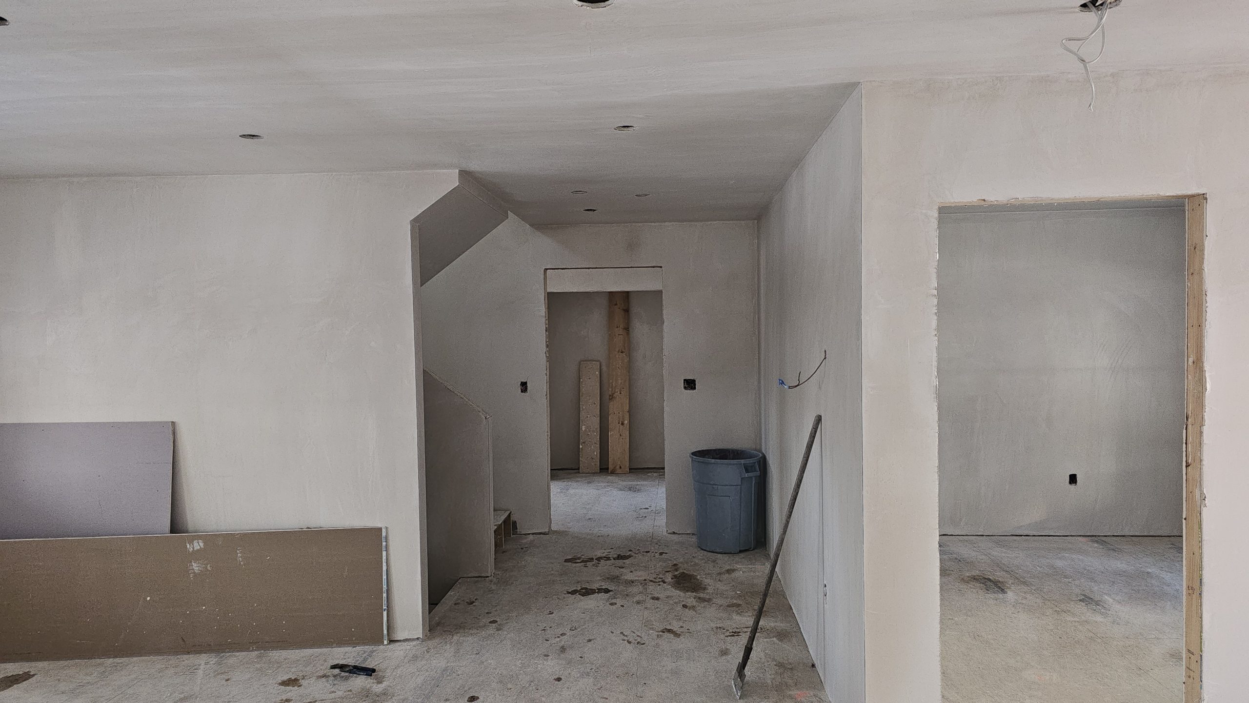 Plaster-finished walls and ceiling around interior doorways in a Worcester project.